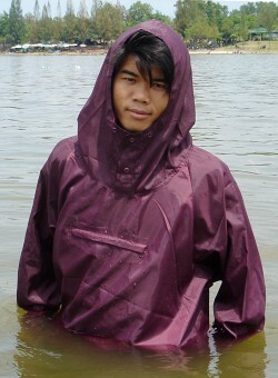 anorak with purple hood in lake as modest swimsuit
