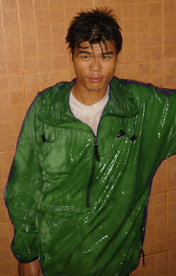 wet green anorak under shower